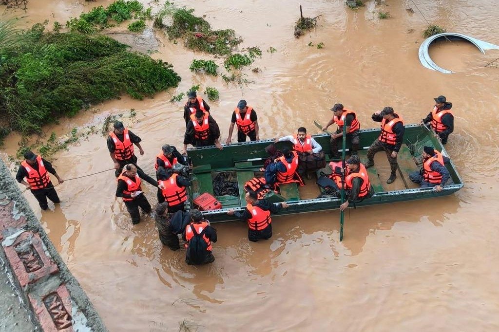 Rescue teams navigating floodwaters near Vaishno Devi landslide site in Jammu and Kashmir